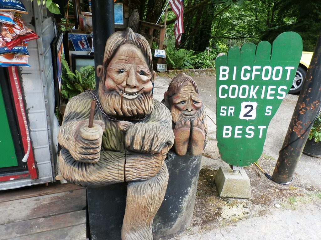 Bigfoot father and son carvings.