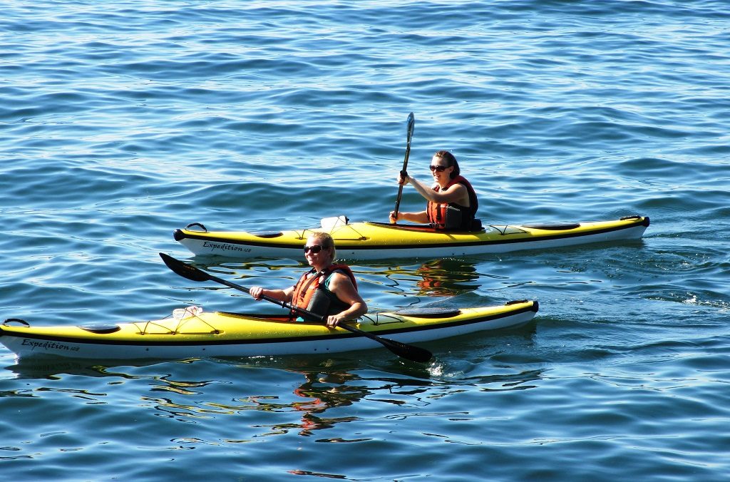 Kayakers enjoying the summer weather in West Seattle (Alki Beach).