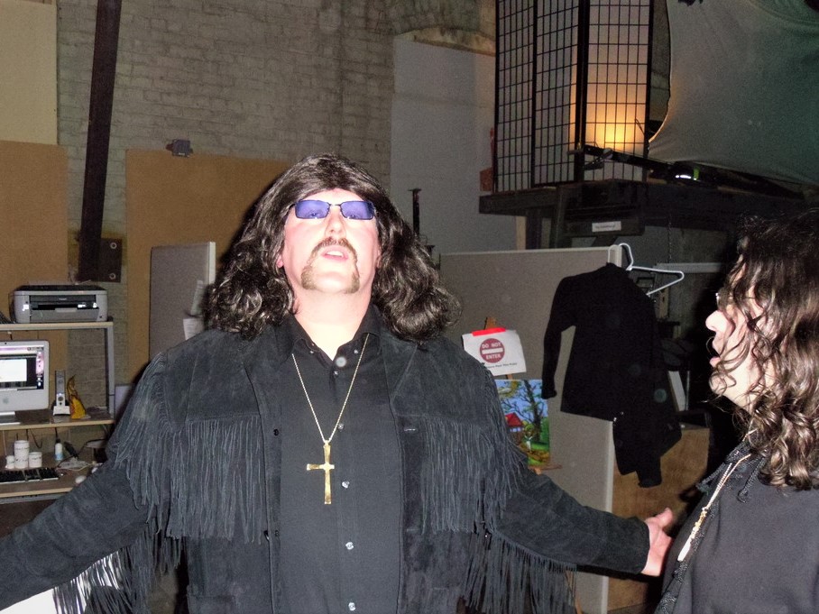 Guitarist Eric Getty, of Seattle-based Black Sabbath tribute Bastard of Reality, posing backstage.